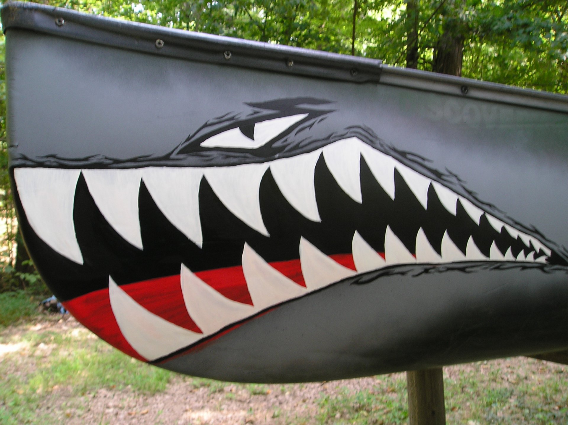HD PC desktop wallpaper featuring a military submarine painted with a fierce shark design along its side, blending naval power with aggressive imagery.