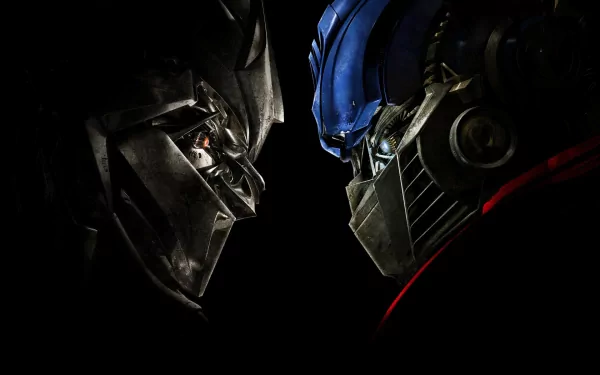 HD desktop wallpaper featuring an intense face-off between Megatron and Optimus Prime from the Transformers movie.