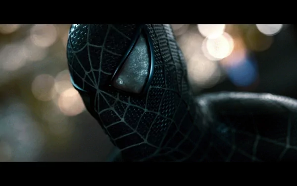 HD desktop wallpaper of Spider-Man in a black suit from the movie Spider-Man 3, featuring a close-up of his mask with a blurred, bokeh background.