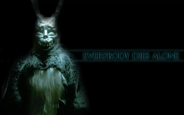 HD desktop wallpaper featuring a dark and eerie image from the movie Donnie Darko with the text EVERYBODY DIES ALONE illuminated on the right side.