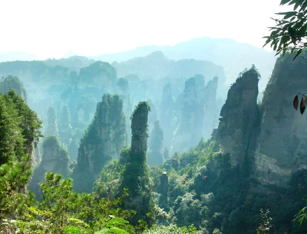 A breathtaking view of towering cliffs amidst lush greenery, showcasing the stunning beauty of nature. This HD image serves as an inspiring desktop wallpaper and background.