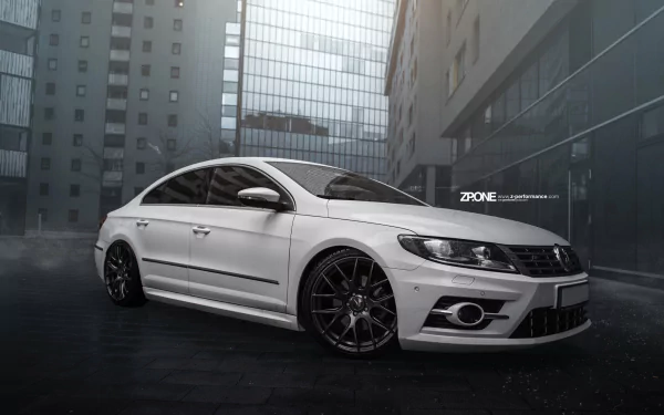 A sleek white Volkswagen CC parked in a modern urban setting, showcased as a 4K Ultra HD PC desktop wallpaper and background.