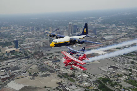  U.S. Navy flight demonstration squadron, the Blue Angels, pilots Fat Albert in formation by Jen Blake