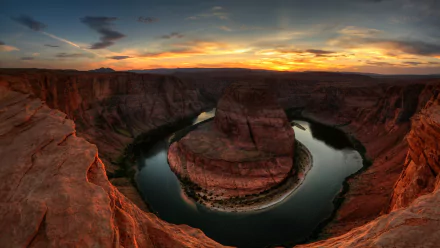 HD PC desktop wallpaper of Horseshoe Bend canyon at sunset, the Colorado River curving around a red sandstone meander beneath a dramatic sky — nature background.