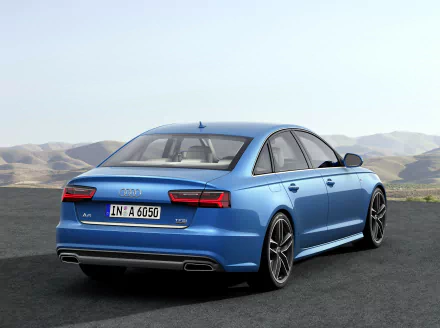 Blue Audi A6 vehicle, rear three-quarter on asphalt with distant mountains — 4K Ultra HD PC desktop wallpaper/background.