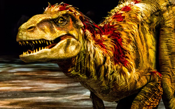 A vividly detailed dinosaur with a fierce expression, featuring realistic textures and colors, set against a dramatic background. An engaging 8K Ultra HD wallpaper for your desktop.