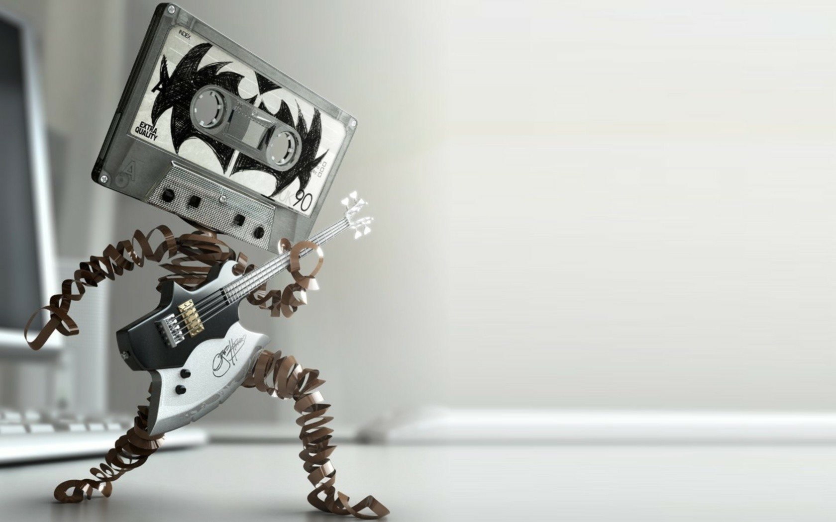 Artistic HD desktop wallpaper featuring a whimsical sculpture of a cassette tape head playing guitar.