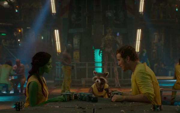Zoe Saldana and Chris Pratt as Gamora and Peter Quill sit across from Rocket Raccoon in a vibrant scene from *Guardians of the Galaxy*, featuring lively background characters.
