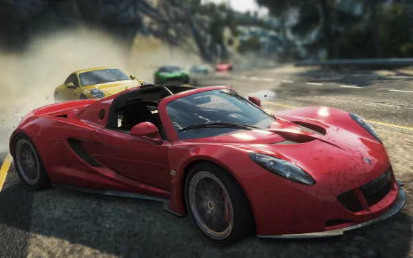 HD PC desktop wallpaper showing a red convertible sports car drifting past rivals on a sunlit mountain road — video game scene from Need for Speed: Most Wanted (2012).