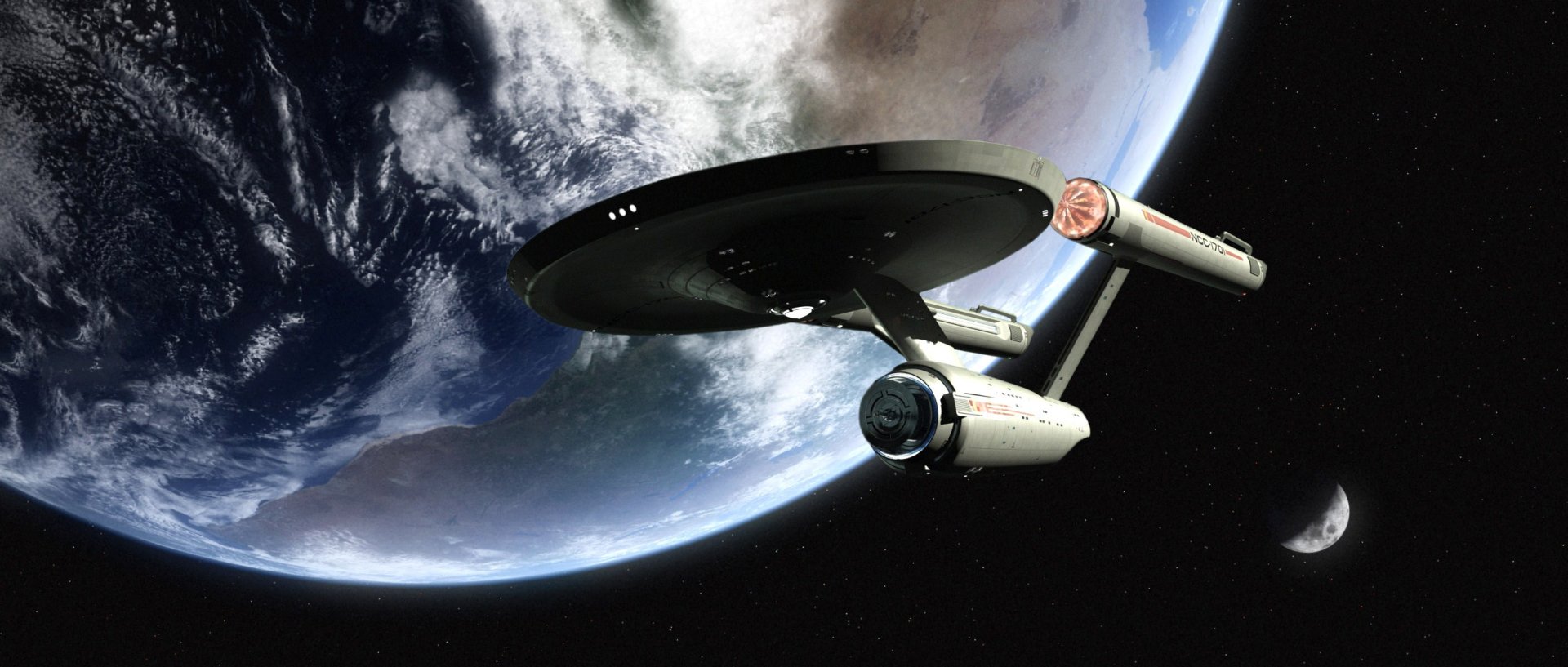 Sci-Fi Star Trek HD PC desktop wallpaper: the starship Enterprise sails over a blue planet, saucer section and twin warp nacelles framed against the starfield.