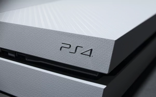 Close-up image of a white PlayStation 4 console, captured in high definition. This wallpaper showcases the sleek and modern design of the gaming system.