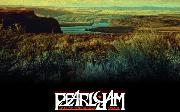 HD PC desktop wallpaper: panoramic river canyon at sunset with grassy foreground and a centered Pearl Jam logo on a black band — music-themed background.