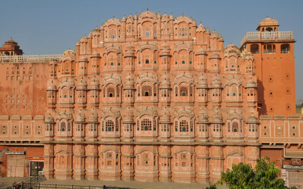 A vibrant HD wallpaper of Hawa Mahal, a stunning man-made structure in Jaipur, India, showcasing its intricate architecture and beautiful pink facade.
