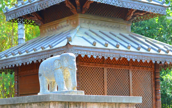 Nepalese pagoda architecture in Brisbane, Australia with a carved elephant statue on a man-made plinth — HD PC desktop wallpaper