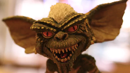 Close-up of a menacing Gremlin from the movie Gremlins, featured as a 4K Ultra HD PC desktop wallpaper and background.