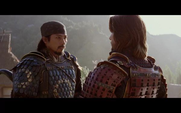 Two samurai in traditional armor converse in a serene setting, captured in an HD wallpaper from the movie The Last Samurai. The image reflects themes of honor and conflict.