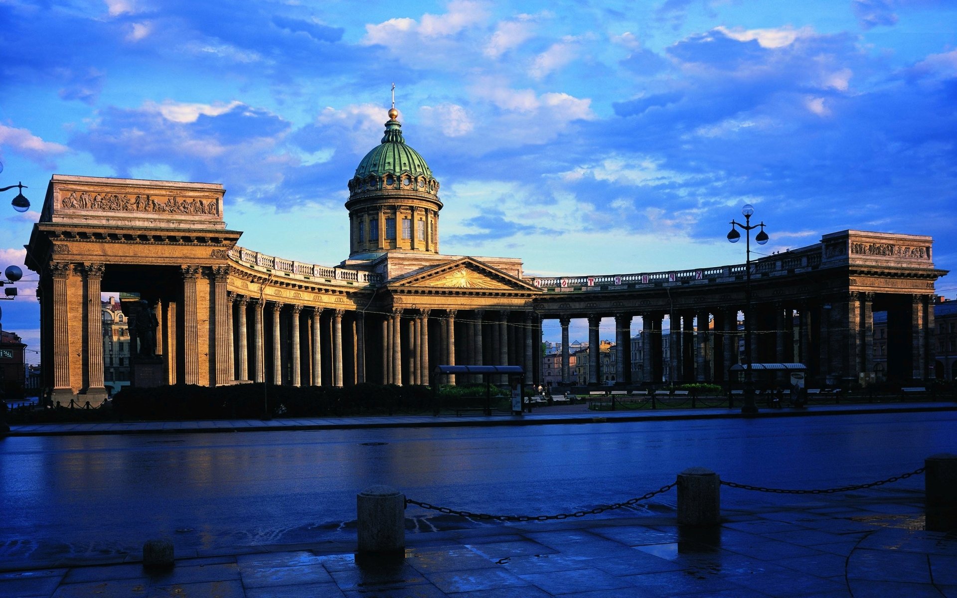 HD desktop wallpaper of Kazan Cathedral in Saint Petersburg, Russia, showcasing its iconic religious architecture against a vibrant evening sky.
