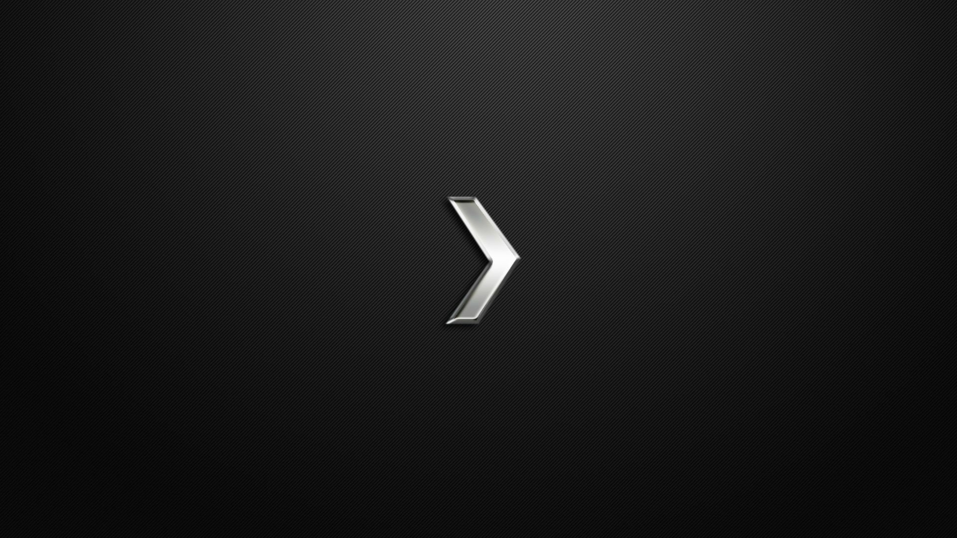 A sleek, HD desktop wallpaper featuring a minimalist design in black with a stylized silver arrow, inspired by the video game Counter-Strike: Global Offensive.