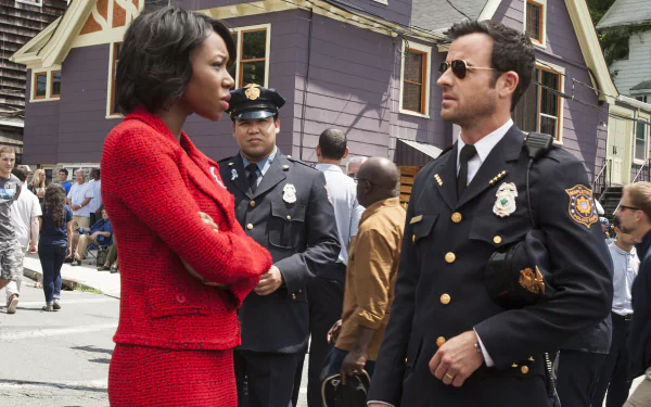 HD PC desktop wallpaper background from TV show The Leftovers: two officers converse on a neighborhood street — woman in red suit and a uniformed male officer among onlookers.