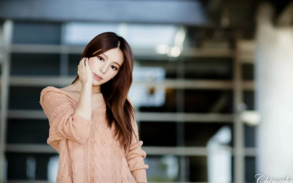 Portrait of Taiwanese woman Julie Chang posing indoors, featured in a 4K Ultra HD PC desktop wallpaper background.