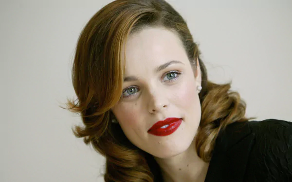 Close-up portrait of an unidentified female celebrity with light-brown curled hair and bold red lipstick, presented as a 4K Ultra HD PC desktop wallpaper/background.