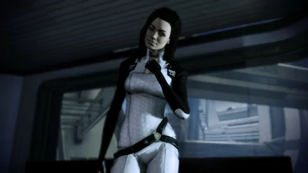 HD PC desktop wallpaper of Miranda Lawson from the Mass Effect video game, standing in a white Cerberus suit inside a ship interior, facing the viewer with a hand near her chest.