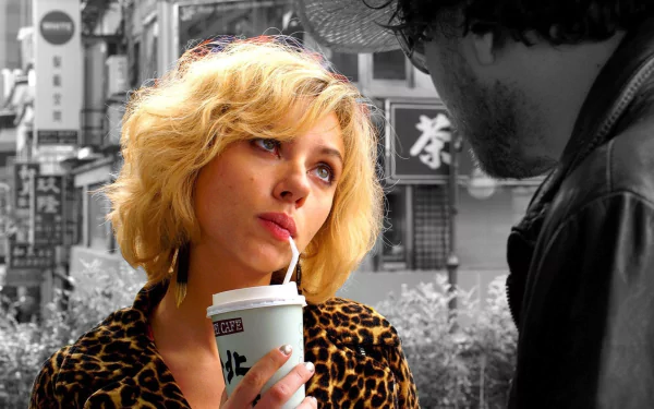 HD PC desktop wallpaper featuring Scarlett Johansson as Lucy from the movie Lucy, set against a black and white urban background, highlighting vivid color accents.