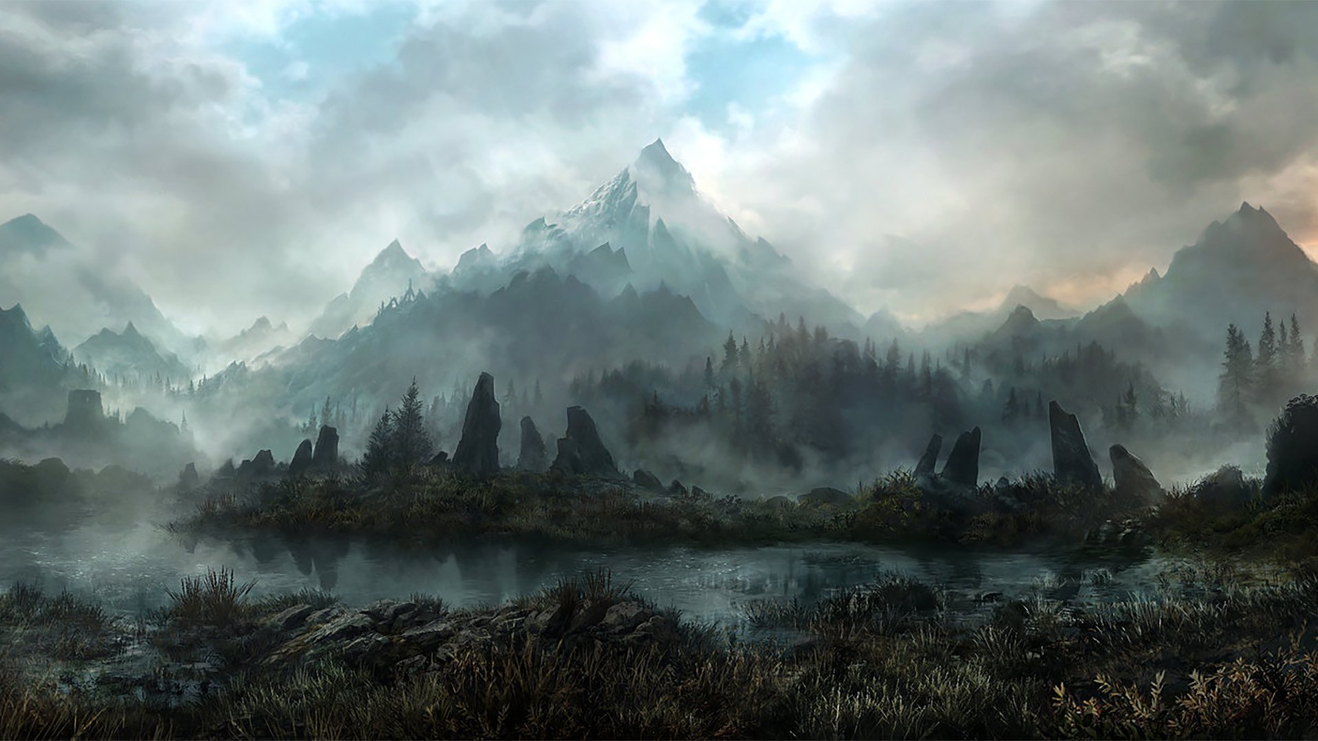 HD desktop wallpaper and background depicting a tranquil nature scene with a misty mountain range towering over a serene, grassy landscape, covered in dense fog under a cloudy sky.