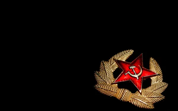 HD desktop wallpaper featuring a golden wreath with a red star and a hammer and sickle symbol, representing communism, against a black background.