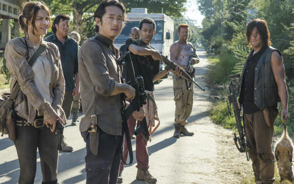 A 4K Ultra HD PC desktop wallpaper featuring characters from the TV show The Walking Dead standing outdoors in a tense group scene.