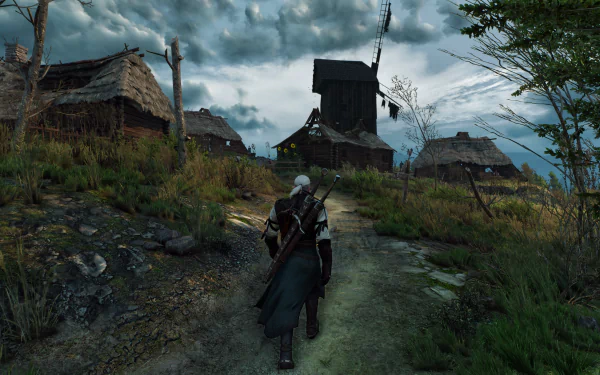 Geralt of Rivia walks down a path toward a rustic village, set against a dramatic sky, in this stunning 4K Ultra HD wallpaper from The Witcher 3: Wild Hunt.