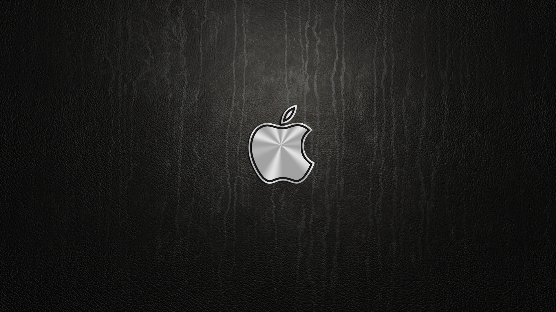 HD desktop wallpaper featuring a sleek metallic Apple Inc. logo centered on a textured dark background, highlighting modern technology aesthetics.