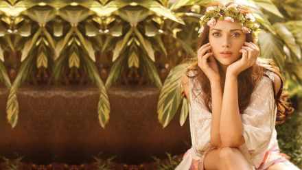 HD desktop wallpaper featuring Indian celebrity Aditi Rao Hydari sitting amidst lush greenery, wearing a flower crown.