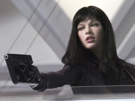 HD PC desktop wallpaper featuring a scene from the movie Ultraviolet, showing a woman with dark hair aiming a gun in a futuristic setting.