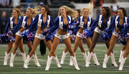Dynamic Dallas Cowboys cheerleaders perform together, showcasing vibrant outfits and spirited dance moves, capturing the excitement of sports in this captivating HD wallpaper.