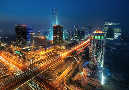 A stunning night view of Beijing, showcasing vibrant skyscrapers and bustling highways, captures the city's dynamic energy in a captivating time-lapse scene.