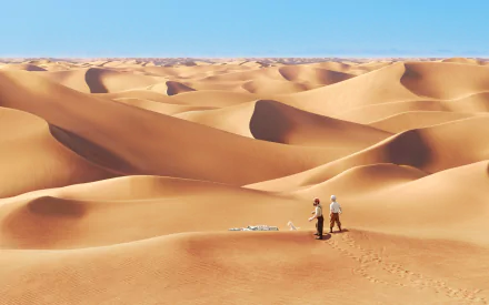 HD desktop wallpaper featuring a vast desert landscape with two characters from The Adventures of Tintin movie exploring the sandy dunes under a clear blue sky.