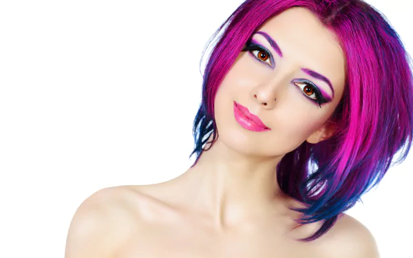A high-definition desktop wallpaper featuring a woman with striking crimson hair and colorful makeup, posing gracefully.