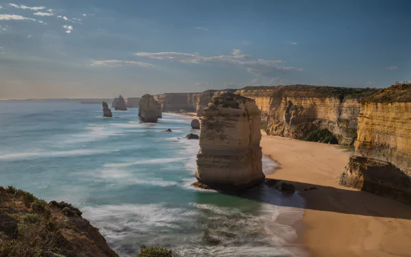 limestone stacks shadow sand wave coastline sea Australia Victoria (Australia) nature The Twelve Apostles HD Desktop Wallpaper | Background Image