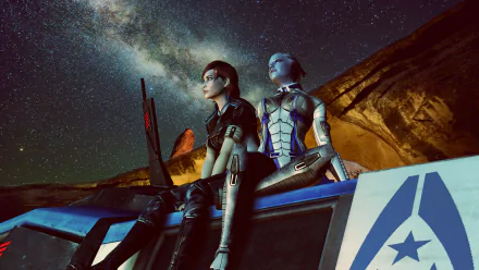 Commander Shepard and Liara T'Soni gaze at a starry night, capturing the essence of the Mass Effect universe in this stunning HD PC desktop wallpaper.