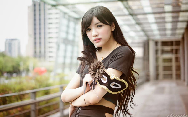 4K Ultra HD image of a Taiwanese Asian model wearing a black mask and outfit, standing against a modern urban background with bokeh effects.