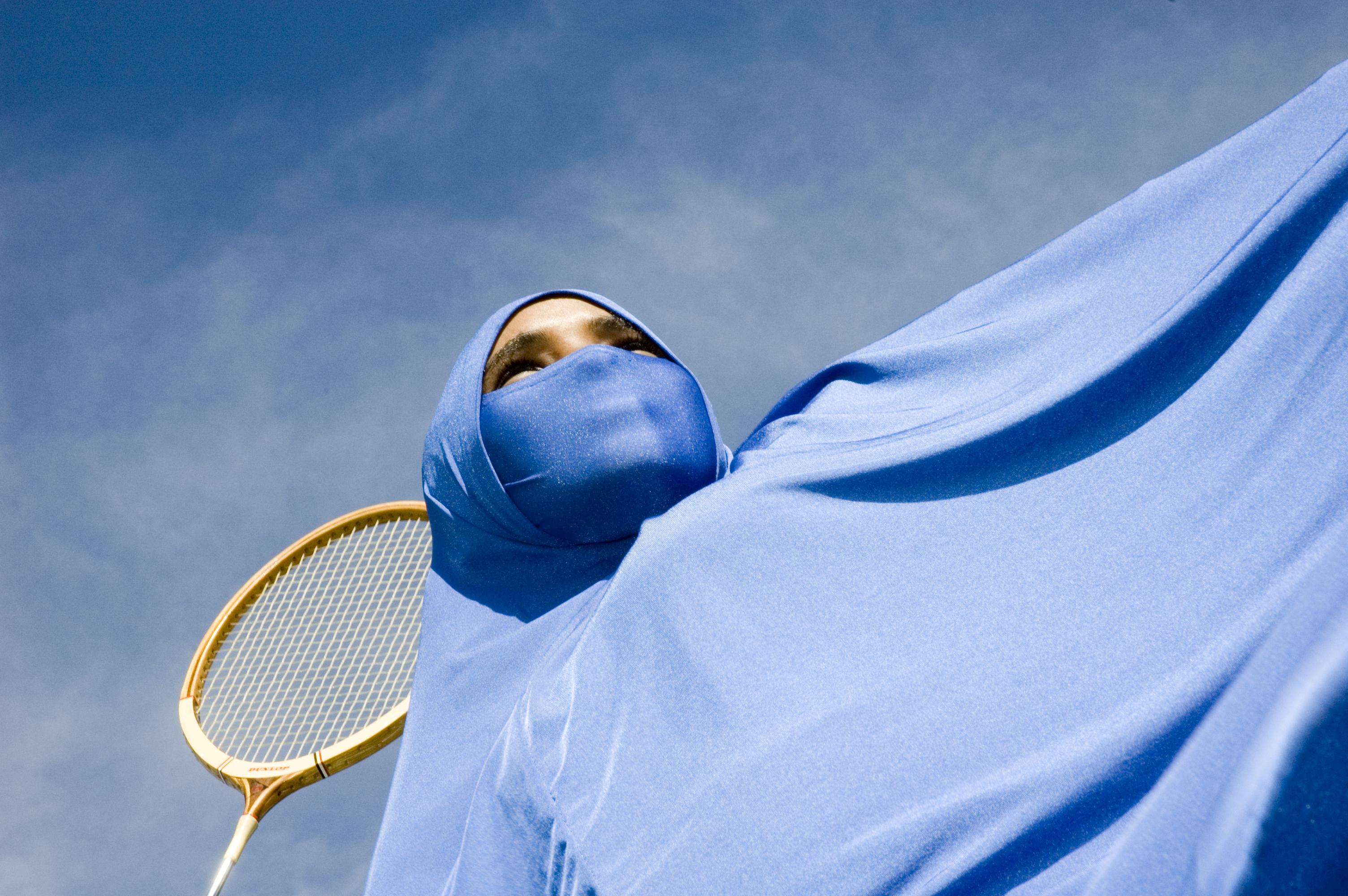 Tennis racquet on a blue background.