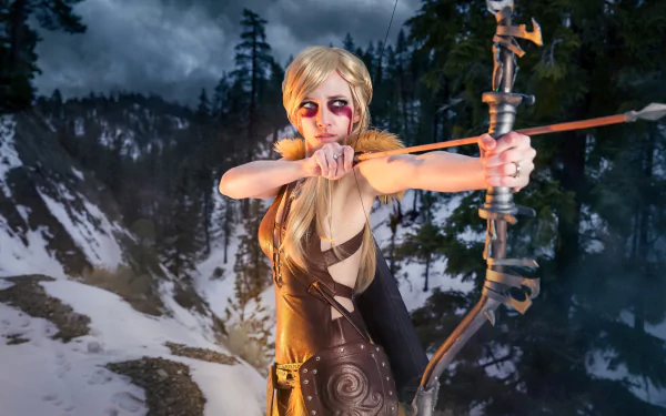 A 4K Ultra HD PC desktop wallpaper featuring a woman in detailed cosplay aiming a bow and arrow against a snowy, forested mountain backdrop.