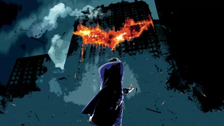 HD wallpaper of Joker from The Dark Knight standing in front of a burning bat-shaped symbol on a building.