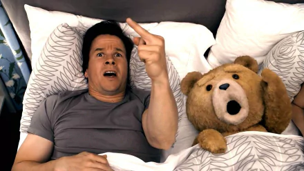 Mark Wahlberg and the movie character Ted lie in bed, both with surprised expressions, in this HD PC desktop wallpaper from the film Ted.