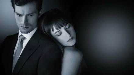 HD desktop wallpaper featuring Jamie Dornan and Dakota Johnson from the movie Fifty Shades of Grey, with a dramatic and intimate black-and-white aesthetic.