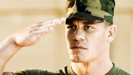 John Cena salutes while portraying a soldier in the movie The Marine. This HD PC desktop wallpaper captures a powerful moment from the film.