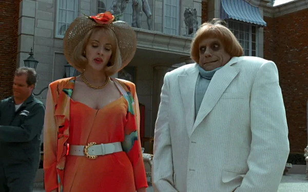 A scene from Addams Family Values featuring a stylish woman in vibrant attire and a quirky man in a white suit, set against a grand building backdrop.