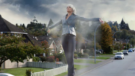 HD PC desktop wallpaper featuring Storm from Marvel Comics in a scene from the movie X-Men: The Last Stand, showcasing her controlling the weather in a suburban neighborhood.