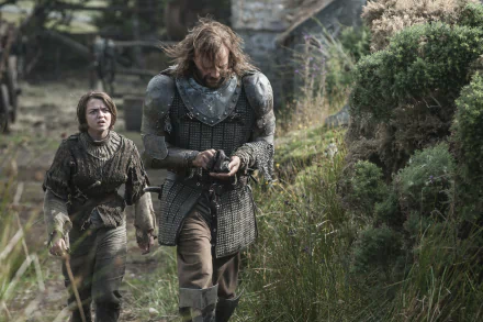 Rory McCann as Sandor Clegane and Maisie Williams as Arya Stark walking together in a scenic landscape from the TV show Game of Thrones, captured in vibrant 4K Ultra HD.